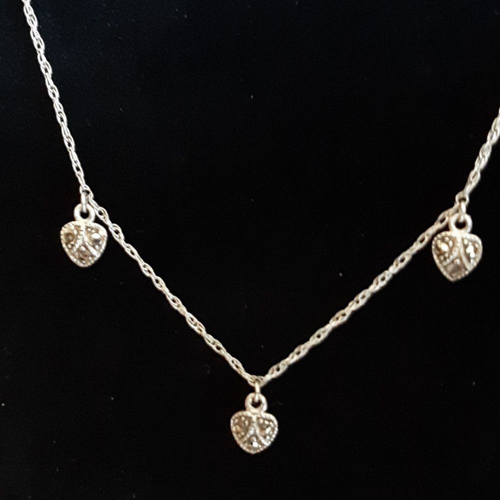 Sterling silver necklace with 3 small sterling hearts